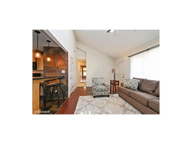 Remodeled Living Room With Vaulted Ceiling and Sky