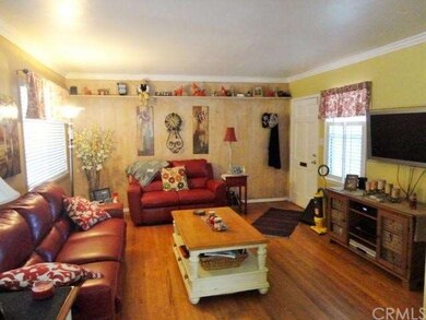 Living room with hardwood flooring.