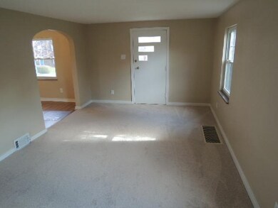 Living Room. New carpet...hardwood floors undernea