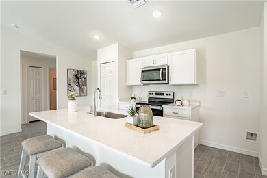 Kitchen with a kitchen breakfast bar, visible vent
