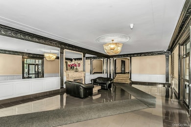 Lobby featuring a decorative wall and a wainscoted wall