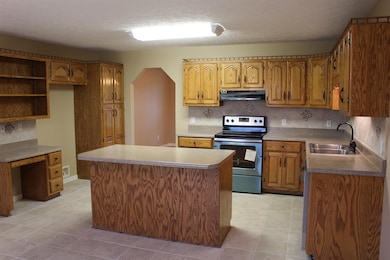 Freshly painted Kitchen has Island storage and bar space