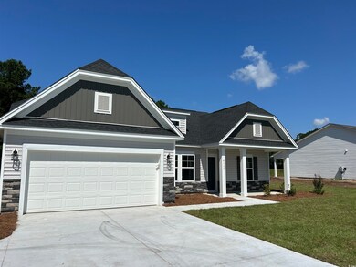 Craftsman inspired home with a front lawn
