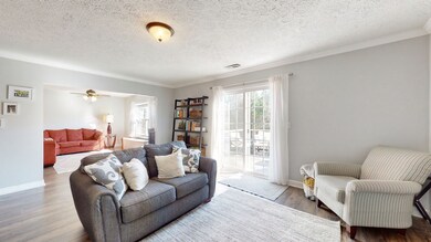 Flooring is the same throughout the entire bottom floor - no carpet on the bottom level.