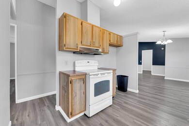 Kitchen featuring a notable chandelier, electric s