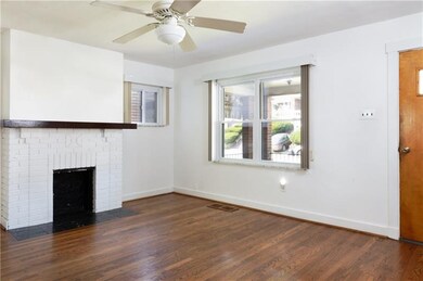 Brick and wood mantle accents add a touch of design to this brightly lit space.