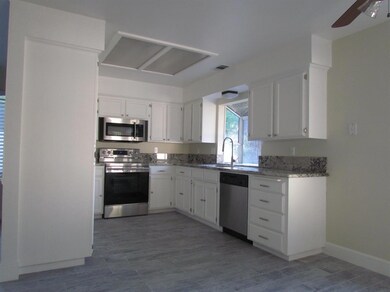 Bright cheery kitchen with lovely granit