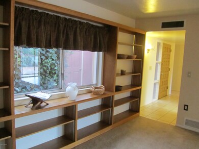 BUILT IN BOOK CASES AND INTO FOYER