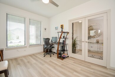 Dazzling natural light graces this spacious study/home office with privacy options, if you wish.