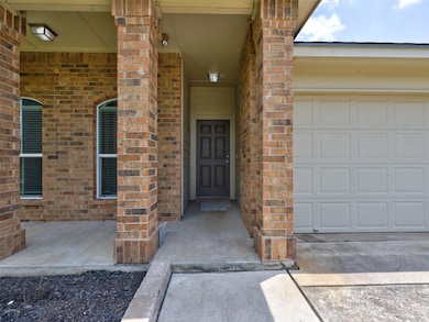 Entrance to property with brick siding