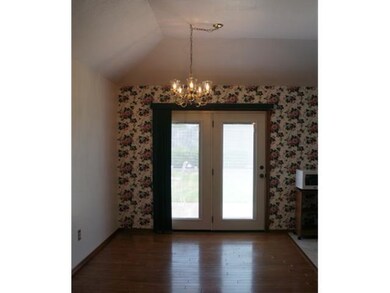 Dining Room. Dining Room has Wood Floors & Vaulted Ceiling