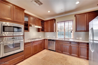 Kitchen featuring visible vents, light stone count