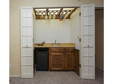 Living Room. Hidden wet bar in the living room!