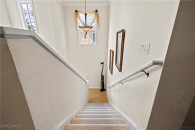 Staircase featuring a textured wall, tile patterne