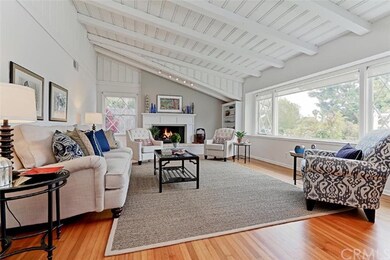 Formal living room with beamed ceilings