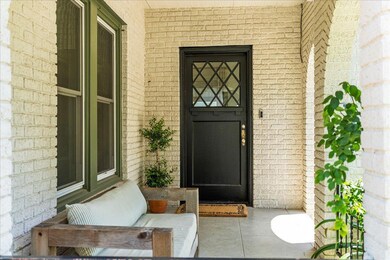 View of exterior entry with brick siding