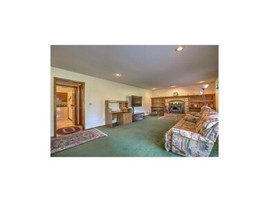 Huge family room with woodburning fireplace insert