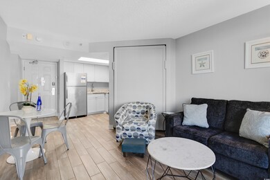 Living area with light wood-style flooring and a t