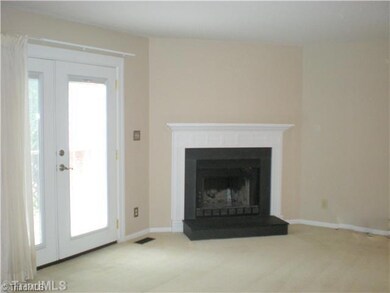 Living Room. Super large living room with cozy fireplace opens to private deck.