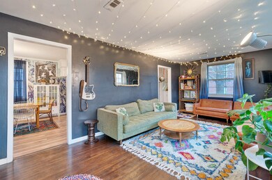 Wonderful interior space with refinished hardwood floors, and lots of space to seat a whole bunch of friends.  Charming strand lights on the ceiling remain.