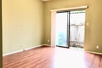 Spare room featuring baseboards and wood finished
