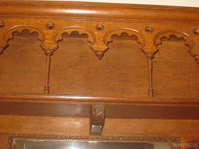 Foyer. Detail of original fireplace mantel.