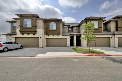 Townhome / multi-family property with stucco sidi