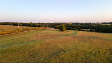 Yard at dusk with a rural view