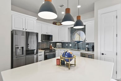 A central island offers additional workspace, comp