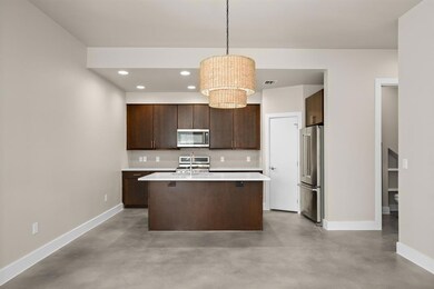 Kitchen with light countertops, baseboards, finis
