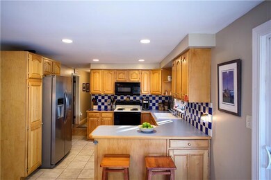 Spacious kitchen with tile floors...