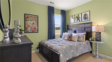 Carpeted bedroom with baseboards