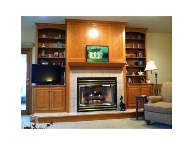 Living Room. Gas Fireplace with Built-In Bookshelv