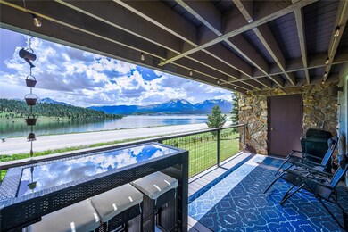 View of patio / terrace featuring a water and moun