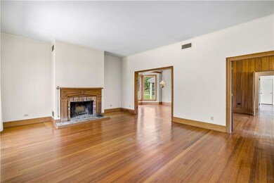 Living Room with large wood burning fireplace that