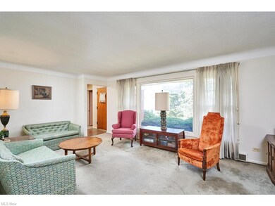 Large living room with huge window faxing the lake