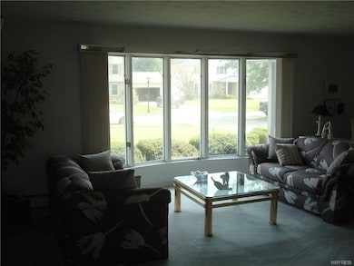 Bay window in living room lets the morning light s