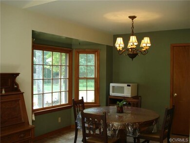 Dining Area with Bay Window opens to Kitchen