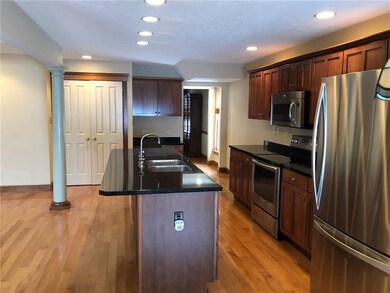 A view of the kitchen from the breakfast area.  No