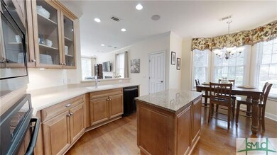 The kitchen, which features light maple cabinetry 
