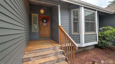 Covered front porch welcomes your guests as they arrive!