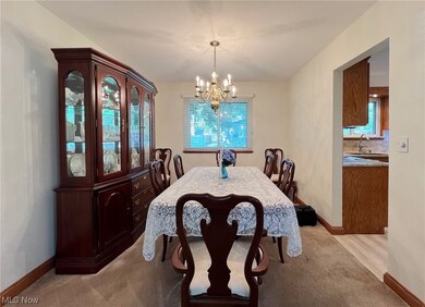 Dining room with dining table and hutch that stays with the house.
