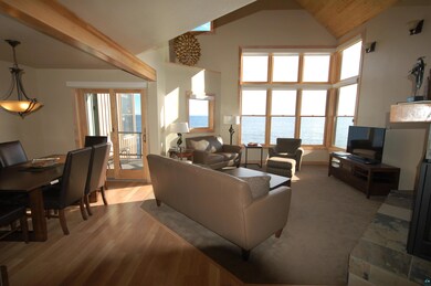 Living room with light wood-type flooring and high