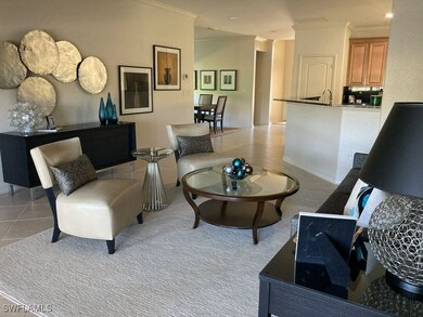 Tiled living room featuring ornamental molding and