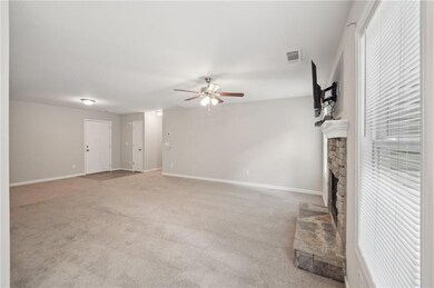 Unfurnished living room with a ceiling fan, basebo