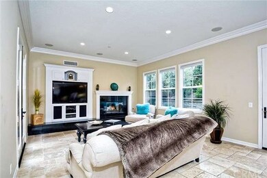 Lavish family room offers fireplace, entertainment