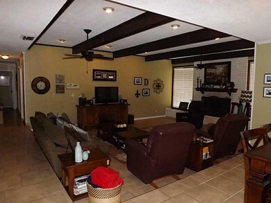 Living Room. Exposed beams in living room with new