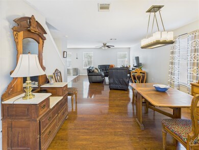 Dining area with dark wood finished floors and ce