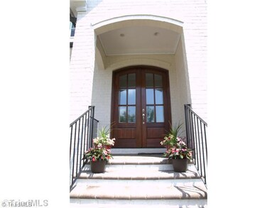 Other. Stone paver sidewalk and porch lead up to Double mahogany 8