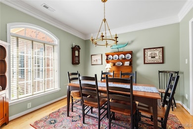 Dining room with triple crown moulding and newer c
